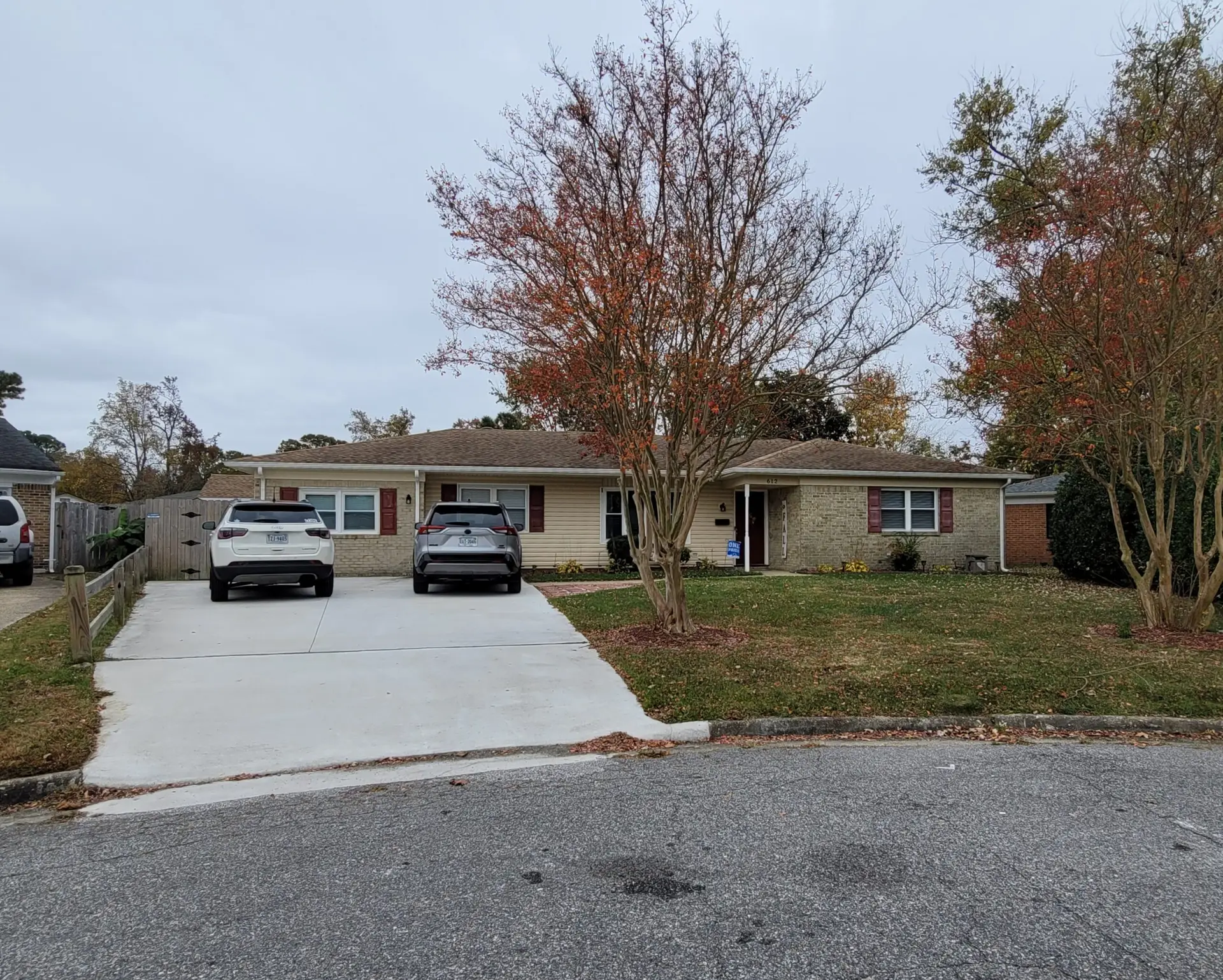 Single-story brick and siding home with an attached garage