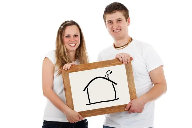 Couple holding sketch of a house in Virginia Beach