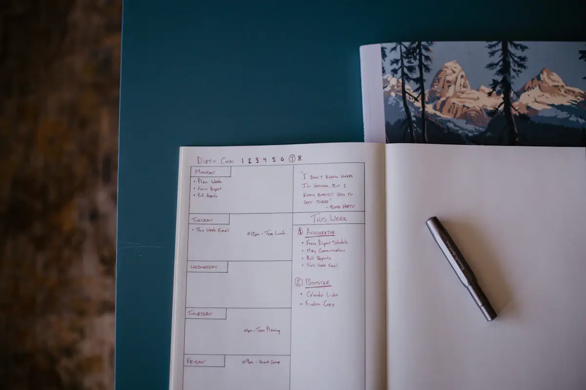 Notebook with a pen resting on it