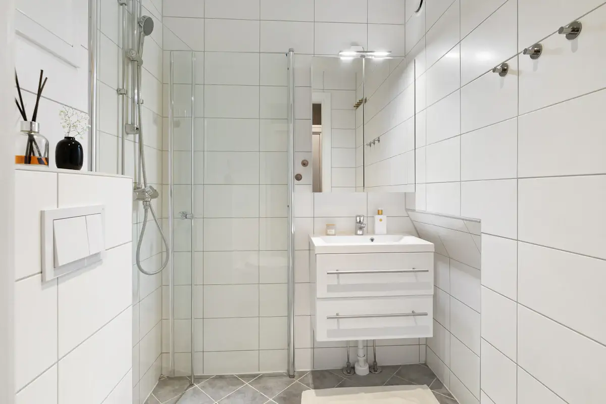 White bathroom with a walk-in shower