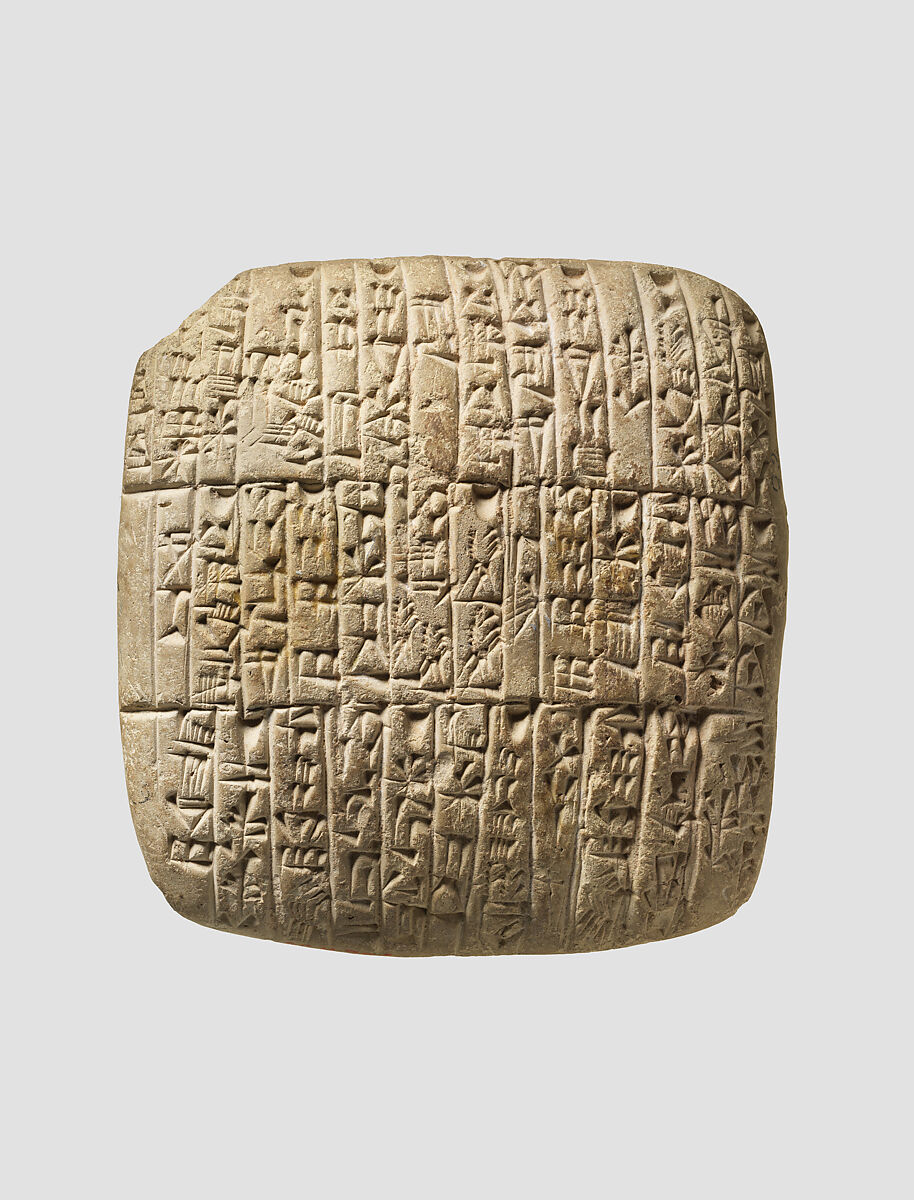 Akkadian clay tablet covered in cuneiform writing