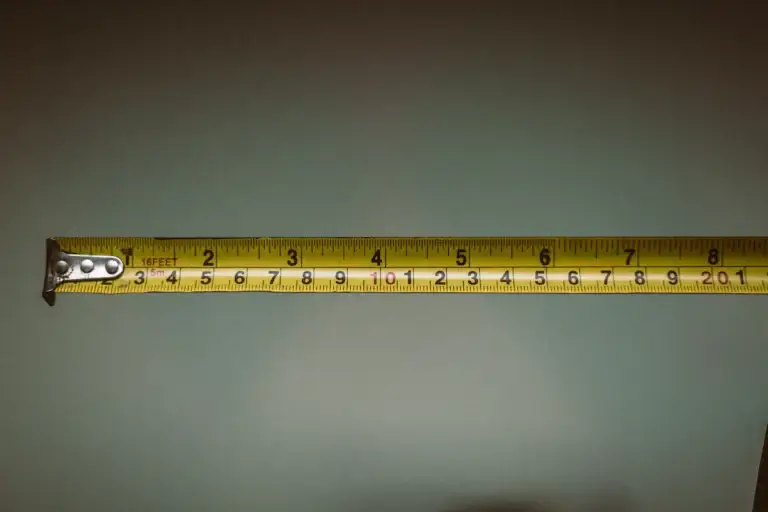 Extended tape measure showing inch and metric scales