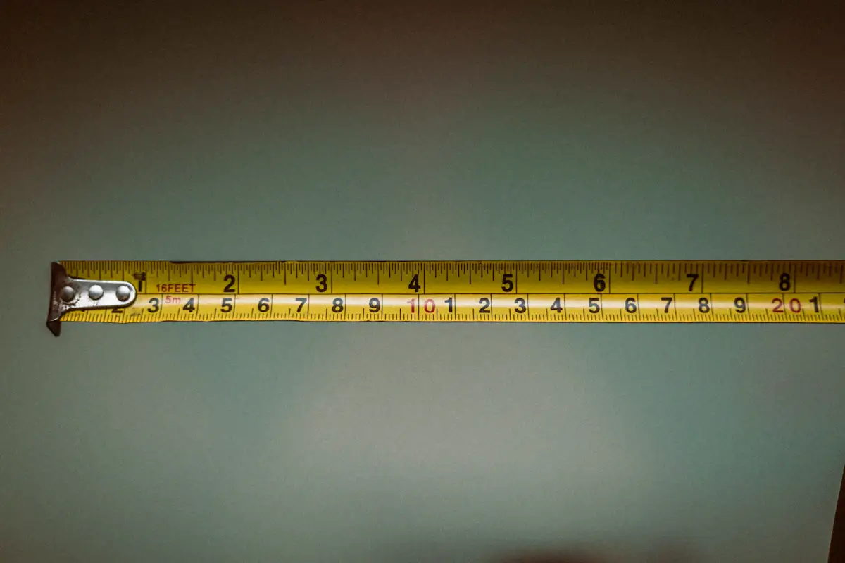 Extended tape measure showing inch and metric scales