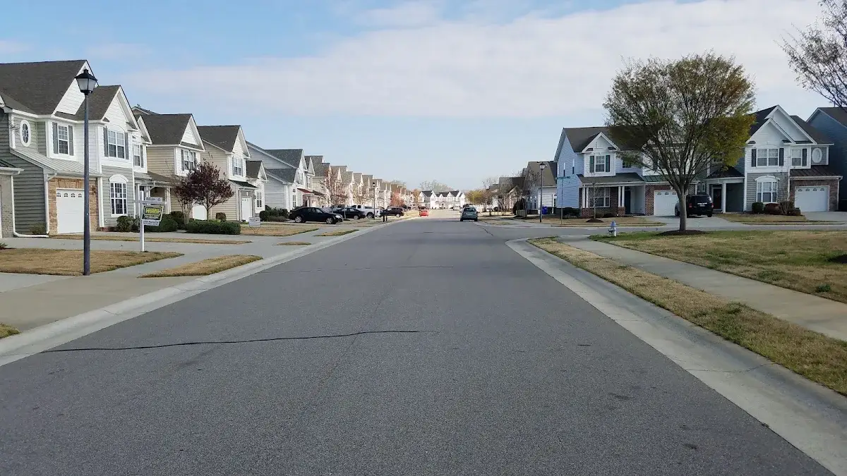 Neighborhood street lined with newer two-story homes